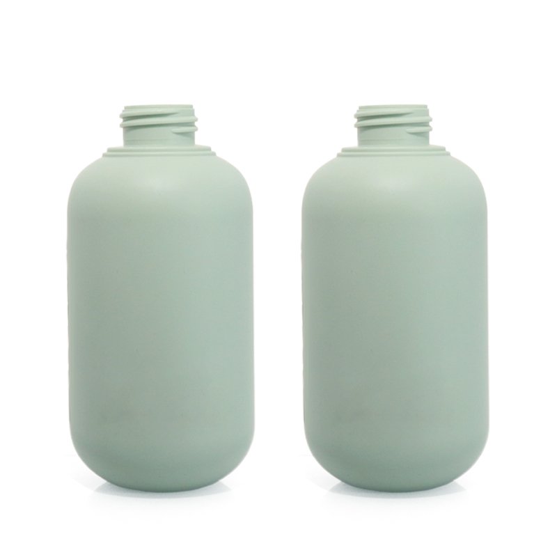 A 500ml white cosmetic bottle photographed against a neutral background, representative of the PET, HDPE and PETG bottles where brands add tamper-evident seals and anti-counterfeit codes