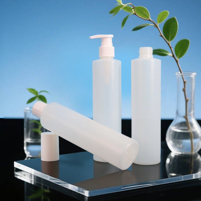 A set of white PET pump bottles lined up together, the kind of production a buyer inspects on the floor when auditing a cosmetic packaging factory